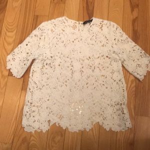 White lace top hitting at hips.